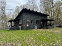 Hunter’s Paradise: Off-Grid Cabin on Nearly 35 Acres!