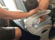 Dad sparks online debate after cradling daughter’s head for 45 minutes so she could sleep during a flight