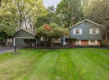 Opportunity Awaits in Penfield: Spacious Home on Half-Acre Lot