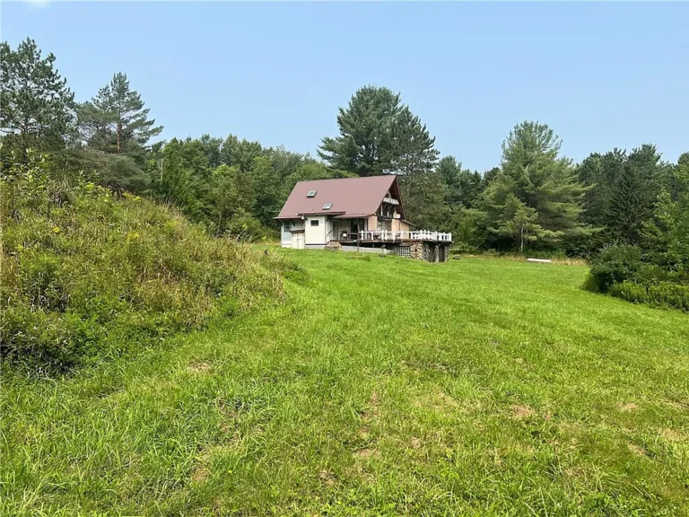 215 Acres of Scenic Seclusion with Charming Camp House and Endless Possibilities