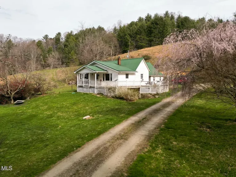 27.6 Acres of East Tennessee Mountain Paradise — Renovated Home, Barns, Creek & Breathtaking Views!