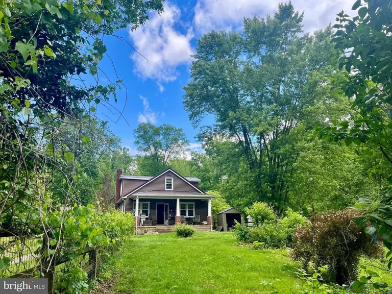 Charming Country Retreat with Bonus Cottage on 3 Acres Along a Stream