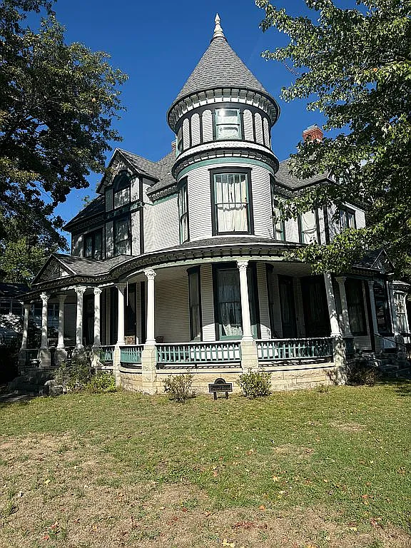 Offered at $250,000, the historic home located at 1128 S Garrison Ave, Carthage, MO 64836
