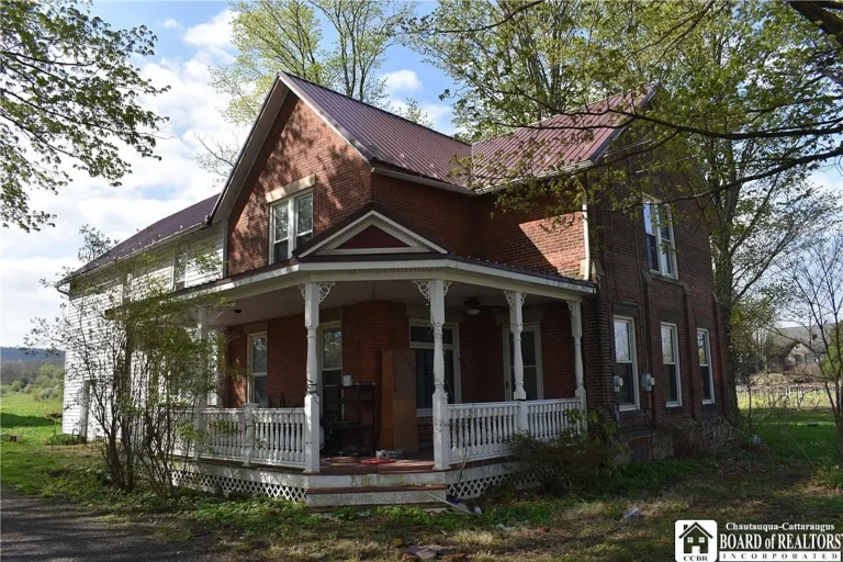 Endless Potential: Spacious Farmhouse with Apartment, Barn & Rolling Acreage – $169,900