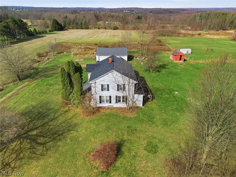 Restore & Reimagine: 6-Bedroom Farmhouse Investment Opportunity in Ravenna – $139,900