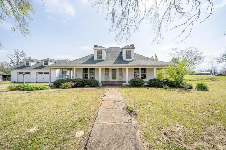 Timeless 1918 Farmhouse on 5 Acres with Modern Upgrades & Wraparound Porch – $199,000