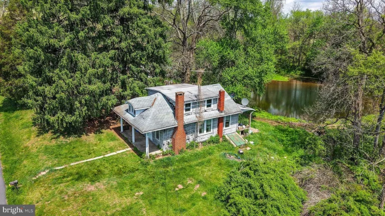 Hidden Potential on Nearly 8 Acres: Country Cape Cod Retreat in Mohnton, Pennsylvania – $185,000