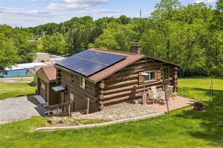 Charming Log Cabin Retreat on One Private Acre with Solar Savings and Valuable Oil & Gas Rights – $188,500