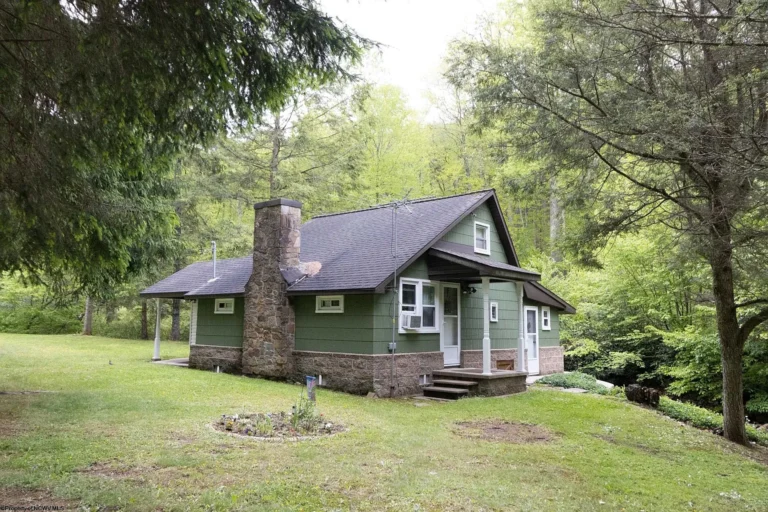 Discover a Hidden Mountain Retreat: Charming Furnished Bungalow with Creek, Pond, and Private Cave in West Virginia – $189,000