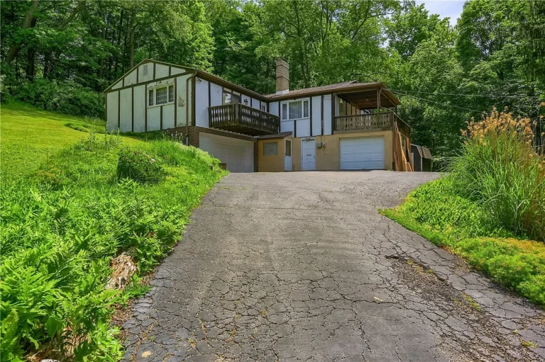 Hidden Mid-Century Modern Gem in Pittsburgh Offers Endless Potential on a Quiet Private Street – $149,900