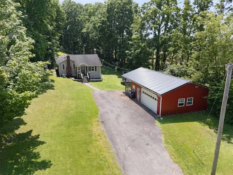 Charming Bungalow on 7.76 Acres Offers Peaceful Country Living with Modern Comforts – $199,000