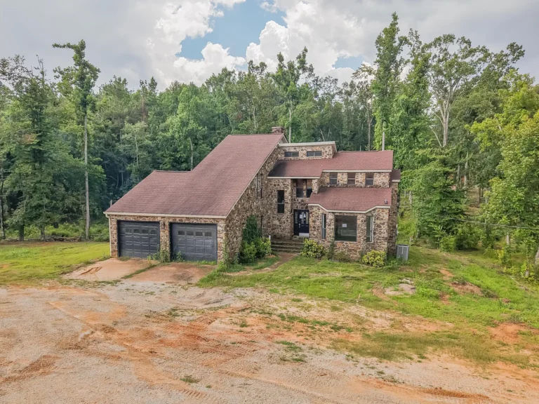 Rustic Stone Home on 2.48 Acres with Wraparound Porch, Fireplaces, and Unlimited Potential in Corinth, Mississippi – $179,900